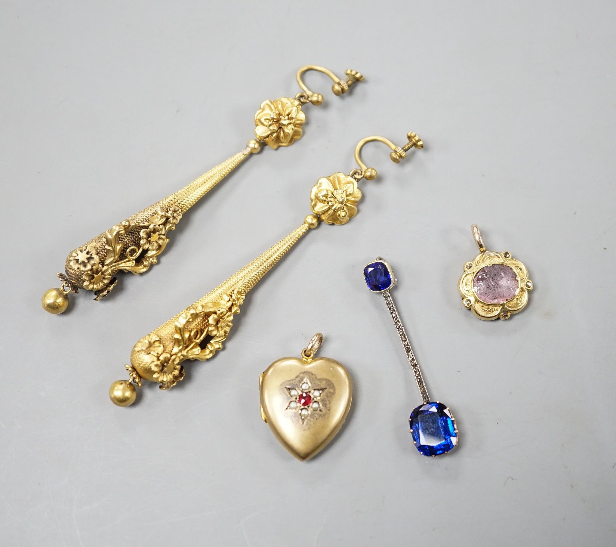 A pair of yellow metal drop earrings, overall 89mm, a simulated sapphire pendant and two other pendants.